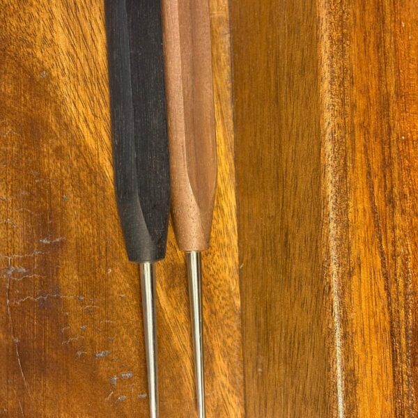 Two Chiarugi oboe mandrels, one black and one brown